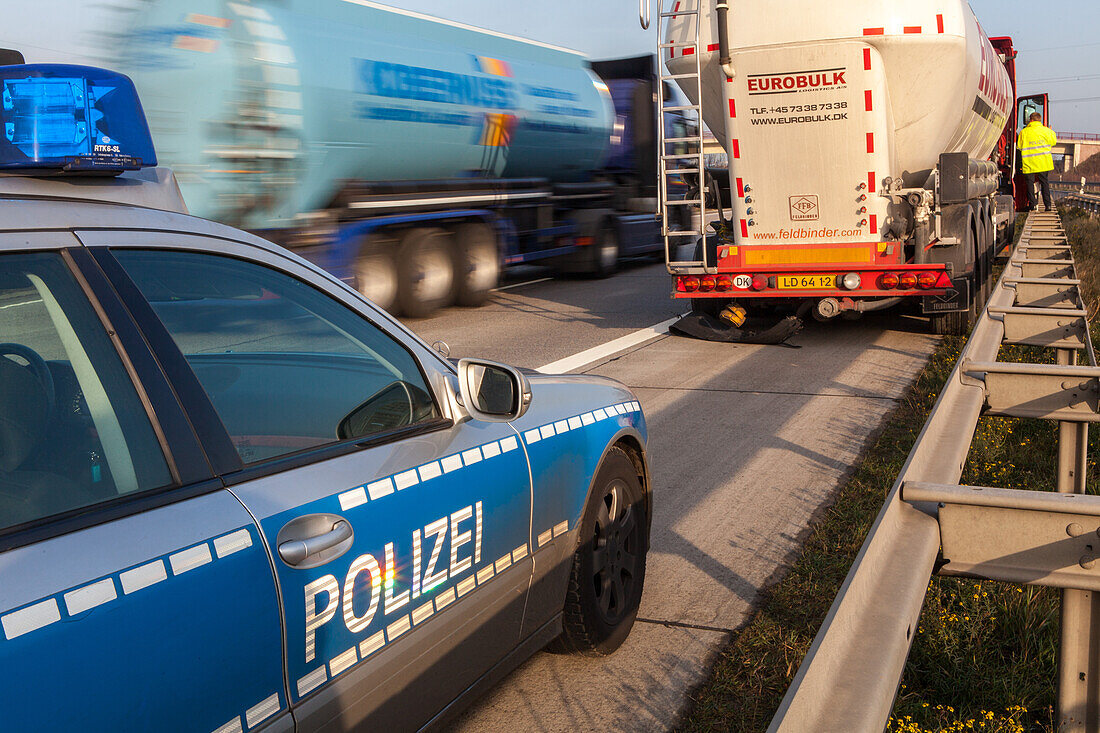 German Autobahn, A 2, police car,  Autobahn police, patrol, control of truck, uniform, crash barrier, guardrail, hard shoulder, motorway, freeway, speed, speed limit, traffic, infrastructure, Hanover, Germany