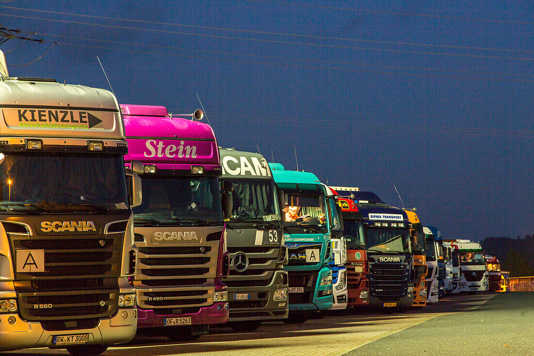 parked trucks at night, German Autobahn, A45, truck stop, motorway, highway, freeway, speed, speed limit, traffic, infrastructure, Wilnsdorf, Germany