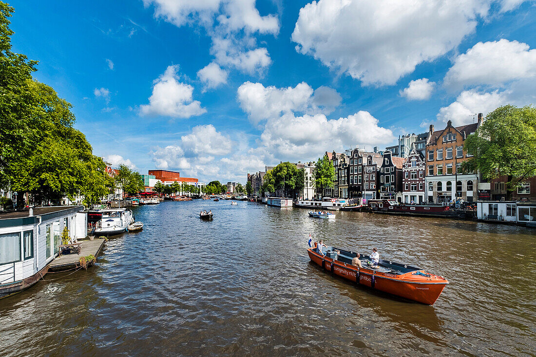 Tourist boats on the Amstel of Amsterdam, Netherland