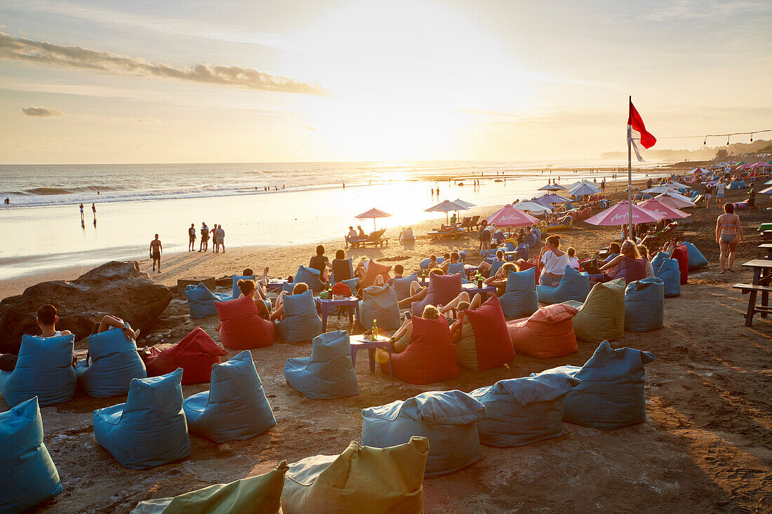 Guests in the beach bar on the beach of Canggu, low tide, Bali, Indonesia