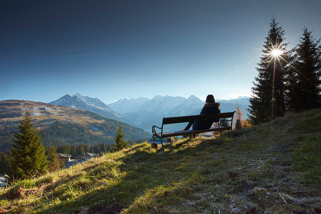 Woman resting on a bench, Gerlospass, Tyrol, Austria