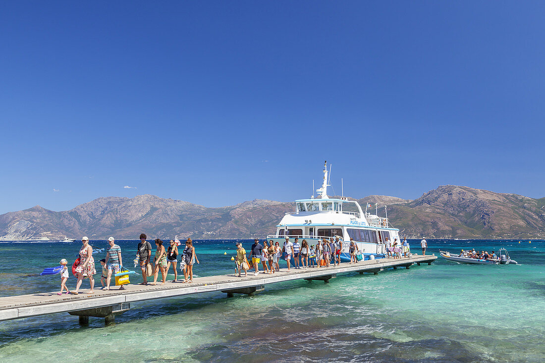Ferry from Saint-Florent arriving on beach Plage de Loto in the Desert of Agriates, Corsica, Southern France, France, Southern Europe