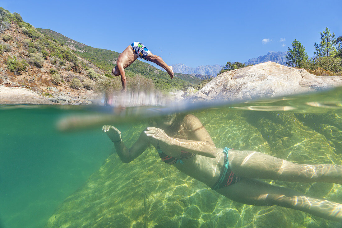 Young woman in a swimming spot in river Fango near Galeria, Corsica, Southern France, France, Southern Europe
