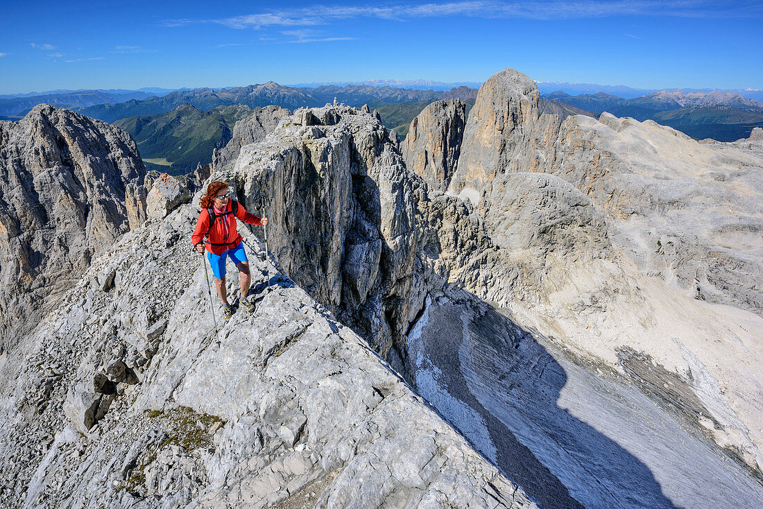 Woman hiking on small ridge, Cima la Fradusta, Val Canali, Pala Group, Dolomites, UNESCO World Heritage Site Dolomites, Trentino, Italy