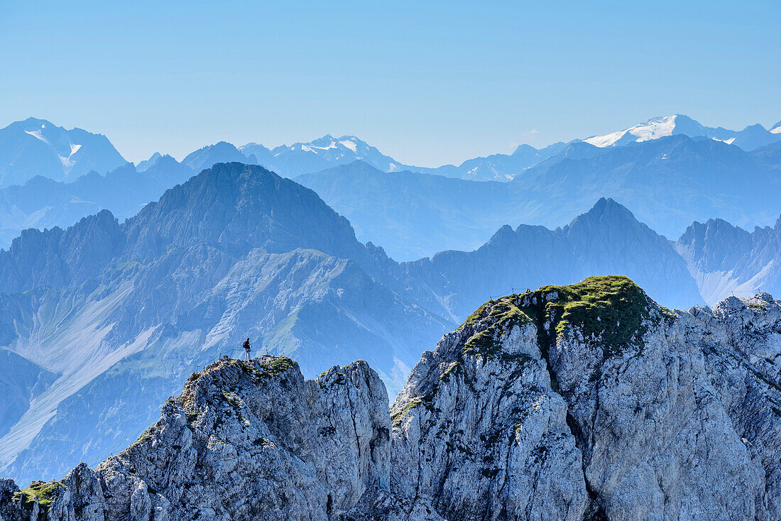 Person walking on fixed-rope route Mittenwalder Hoehenweg, Stubai Alps in background, fixed-rope route Mittenwalder Hoehenweg, Karwendel range, Upper Bavaria, Bavaria, Germany