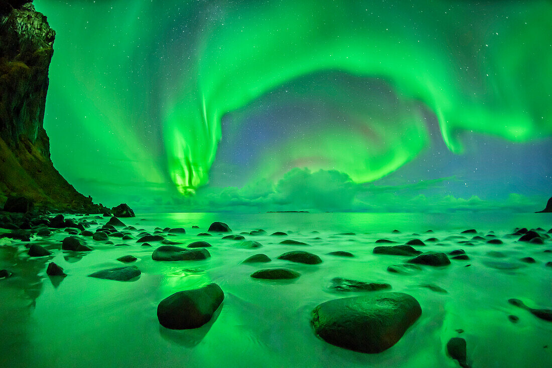 Aurora borealis, Aurora above beach and Northern Atlantic Ocean, Lofoten, Norland, Norway