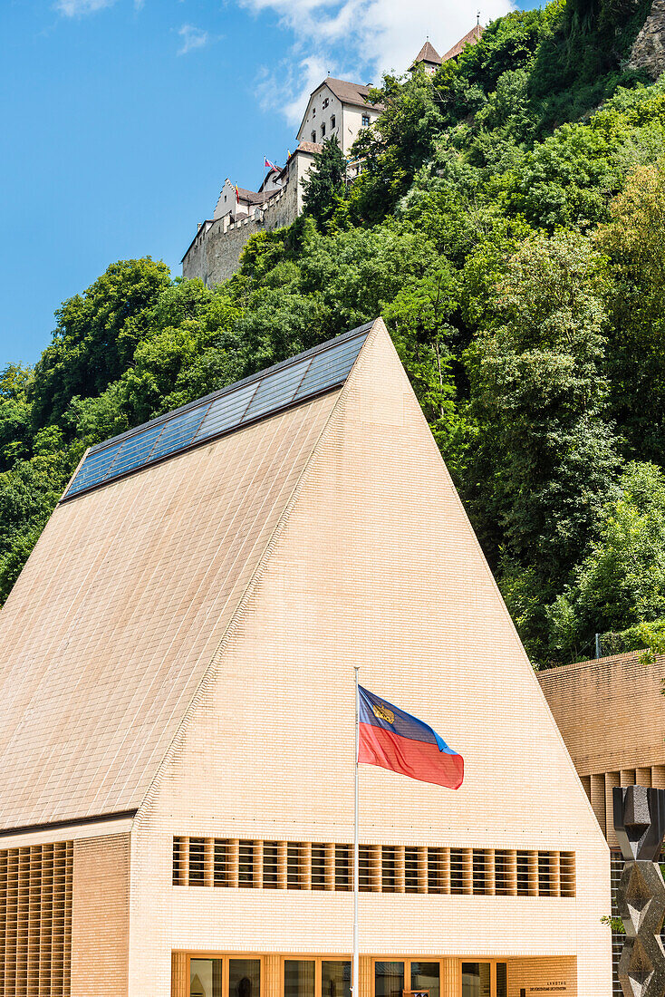 House of the federal state parliament and the Vaduz castle which lies on a rock terrace above the capital of the principality, Vaduz, Liechtenstein