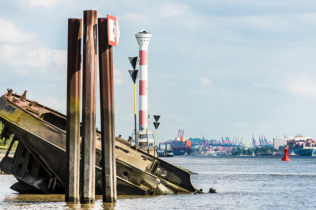 A ship wreck in the Elbe in front of Blankenese with view upstream, river Elbe, Hamburg, Germany