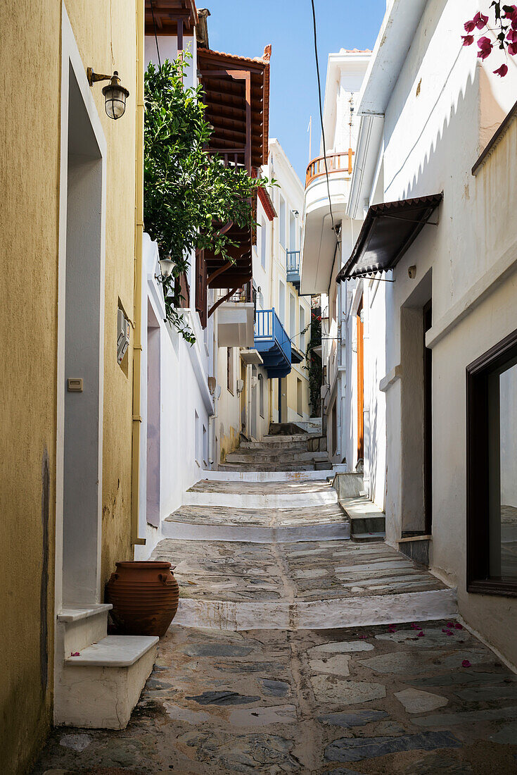 A narrow alley between houses on a greek island, Panormos, Thessalia Sterea Ellada, Greece