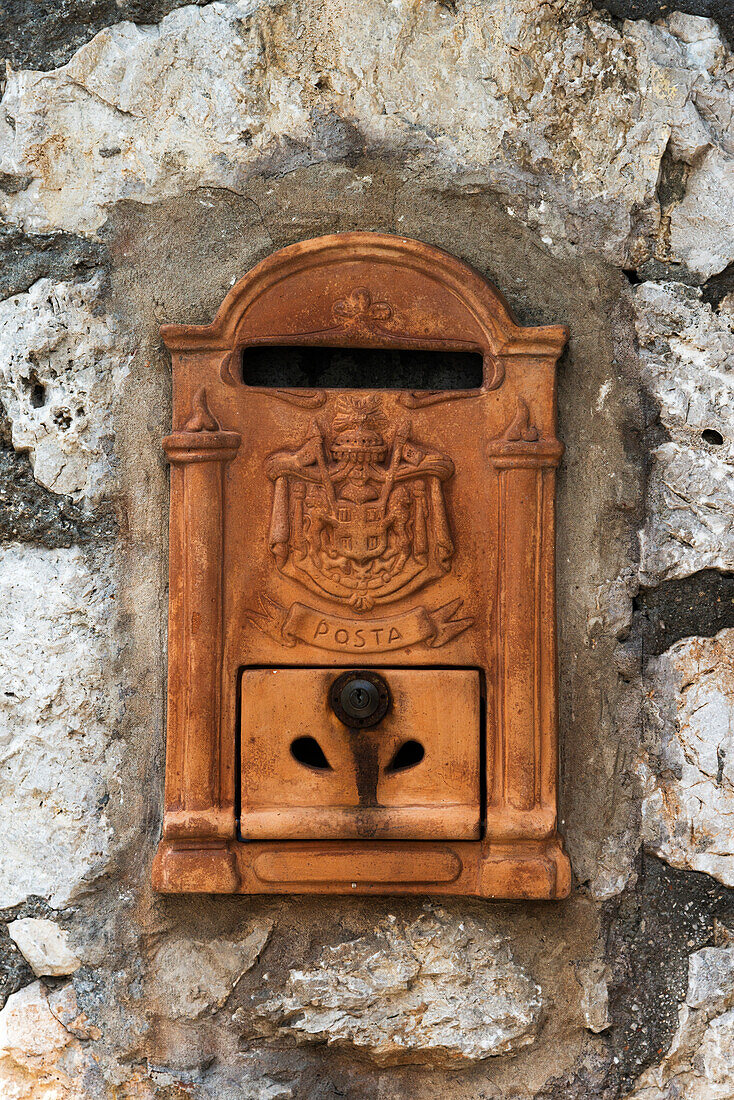 An old mailbox in a weathered stone wall, Capri, Campania, Italy