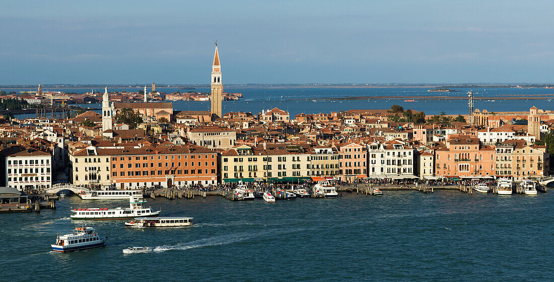 Cityscape of Venice with towers along the skyline and boats in the canal, Venice, Italy