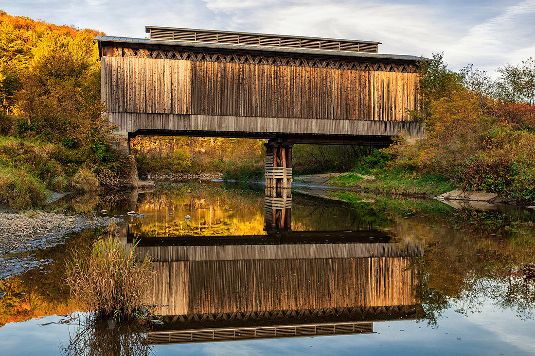 Fisher covered railroad bridge over Lamoille River in autumn, Wolcott, Vermont, United States of America