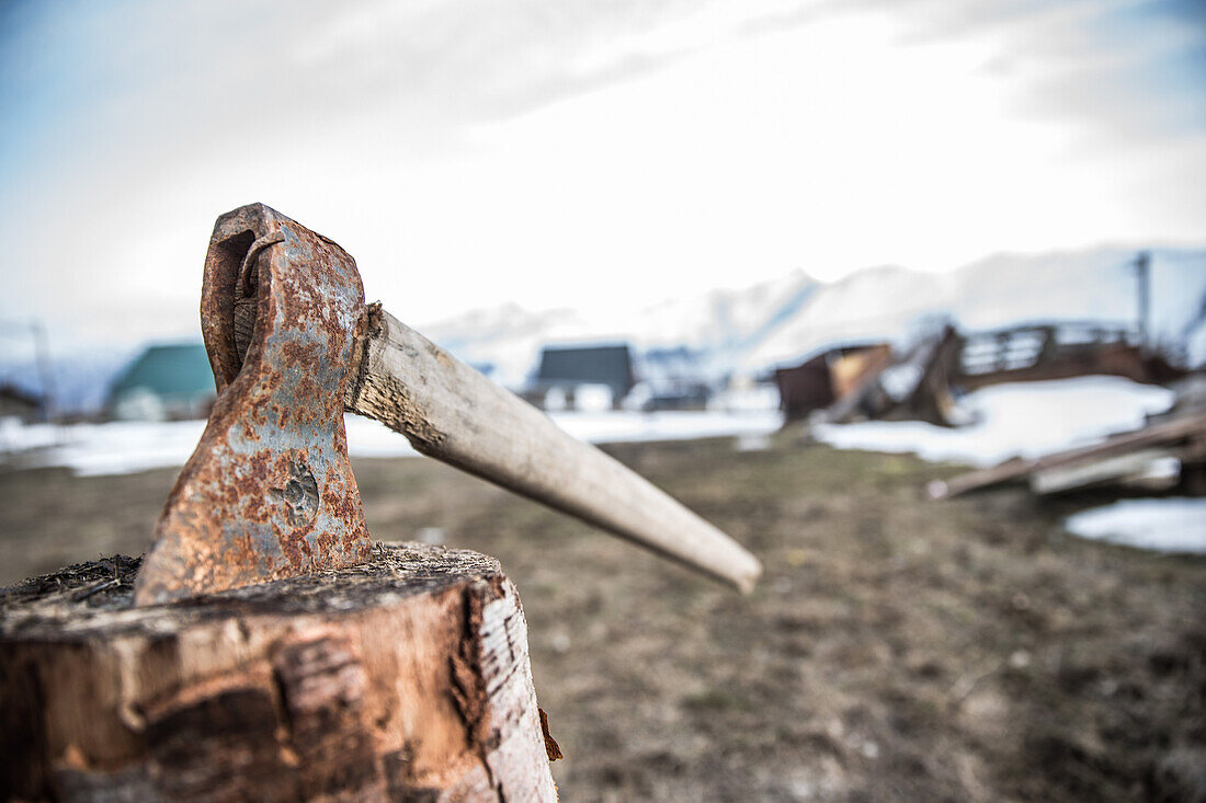 Old rusty axe in a wooden trunk, Gudauri, Mtskheta-Mtianeti, Georgia