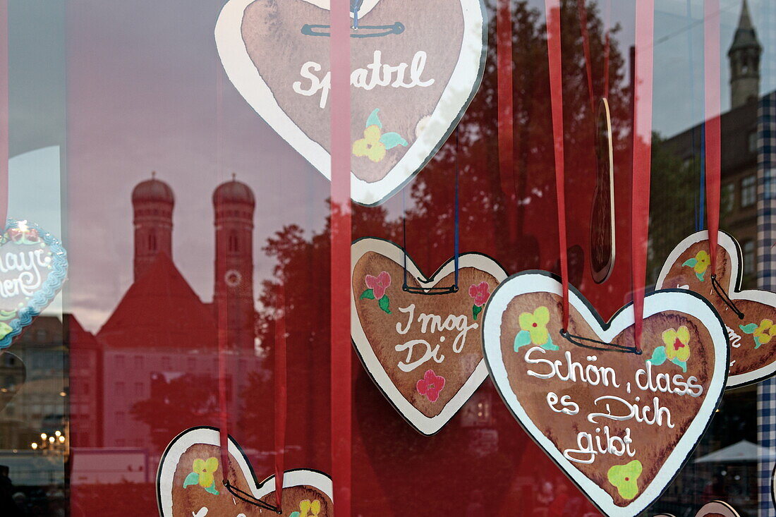 Reflection of Frauenkirche in the shop window of Dallmayr, Dienerstrasse, Munich, Bavaria, Germany