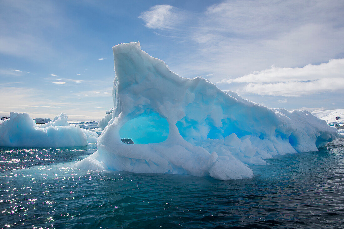 Blue iceberg with holes Cierva Cove, Graham Land, Antarctic Peninsula, Antarctica