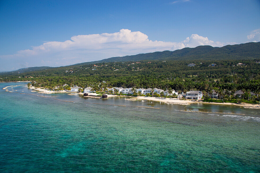 Aerial of coastline and Half Moon Resort seen from parasail Rose Hall, near Montego Bay, Saint James, Jamaica