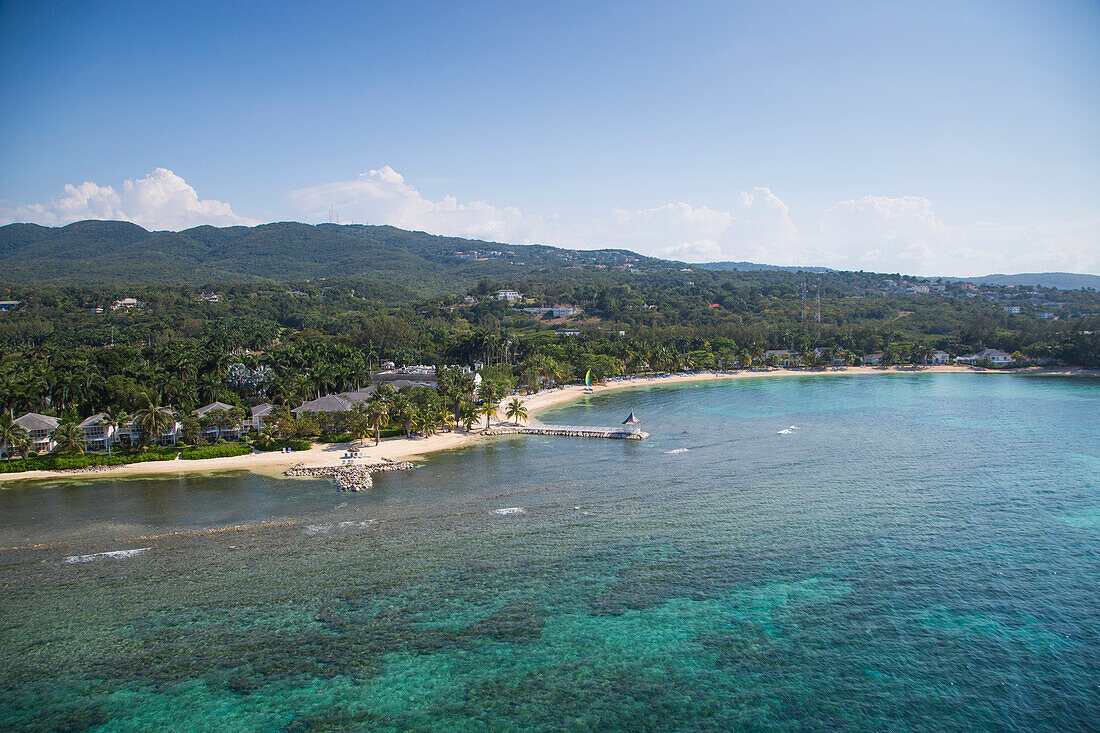 Aerial of coastline and Half Moon Resort seen from parasail Rose Hall, near Montego Bay, Saint James, Jamaica