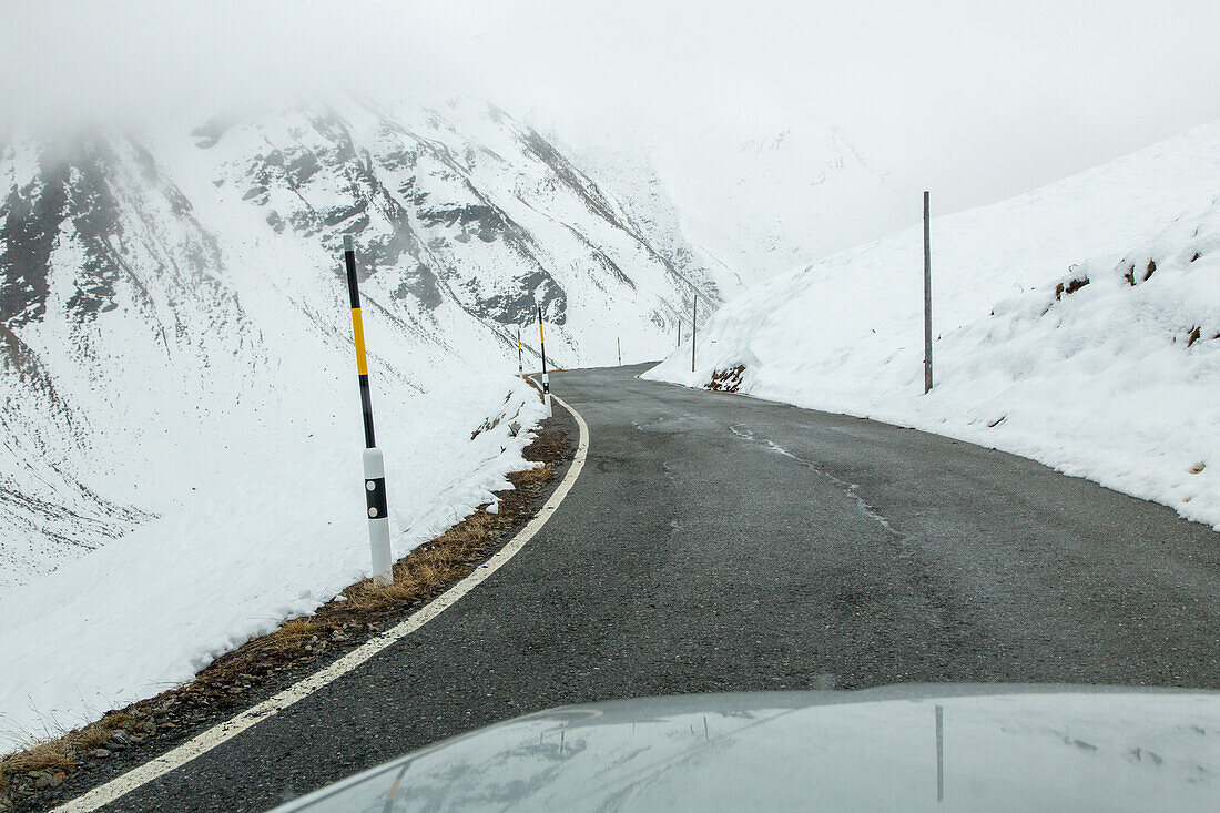 Stelvio Pass in autumn, early snow, empty road, mountain Pass, Alps, Italy