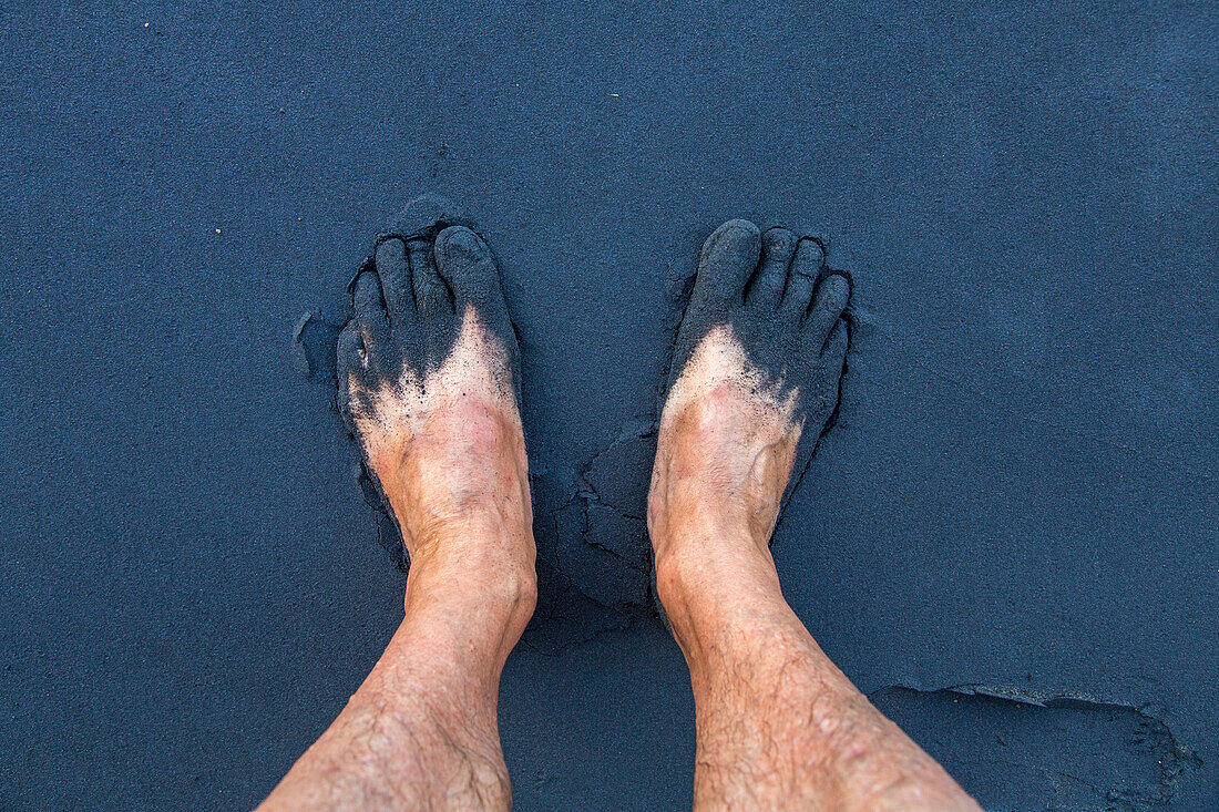 whiteman's feet in black sand, volcanic beach, selfie, from above, Taranaki Coast North Island, New Zealand