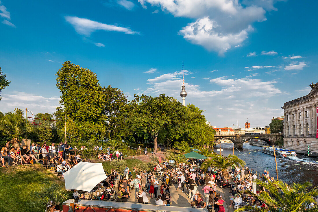 People dancing near the Spree River and Bode Museum, Berlin, Germany