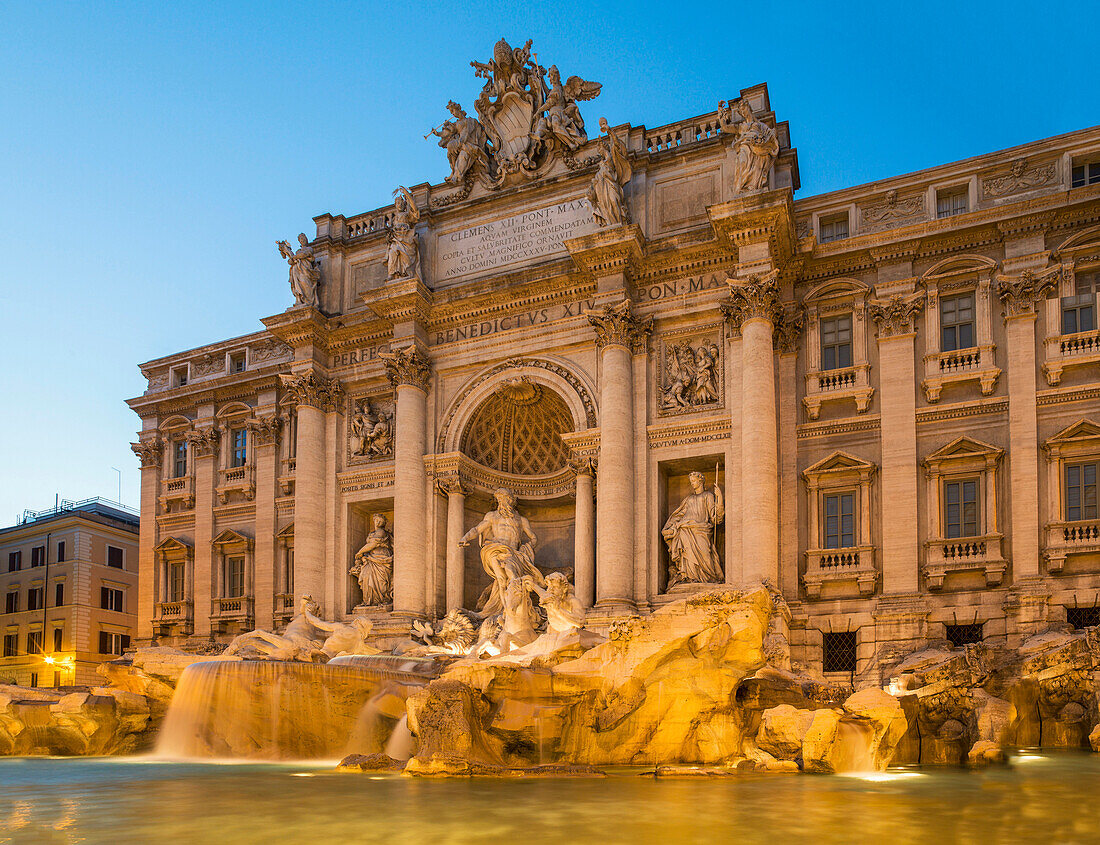 Trevi Fountain under ornate building, Rome, Lazio, Italy