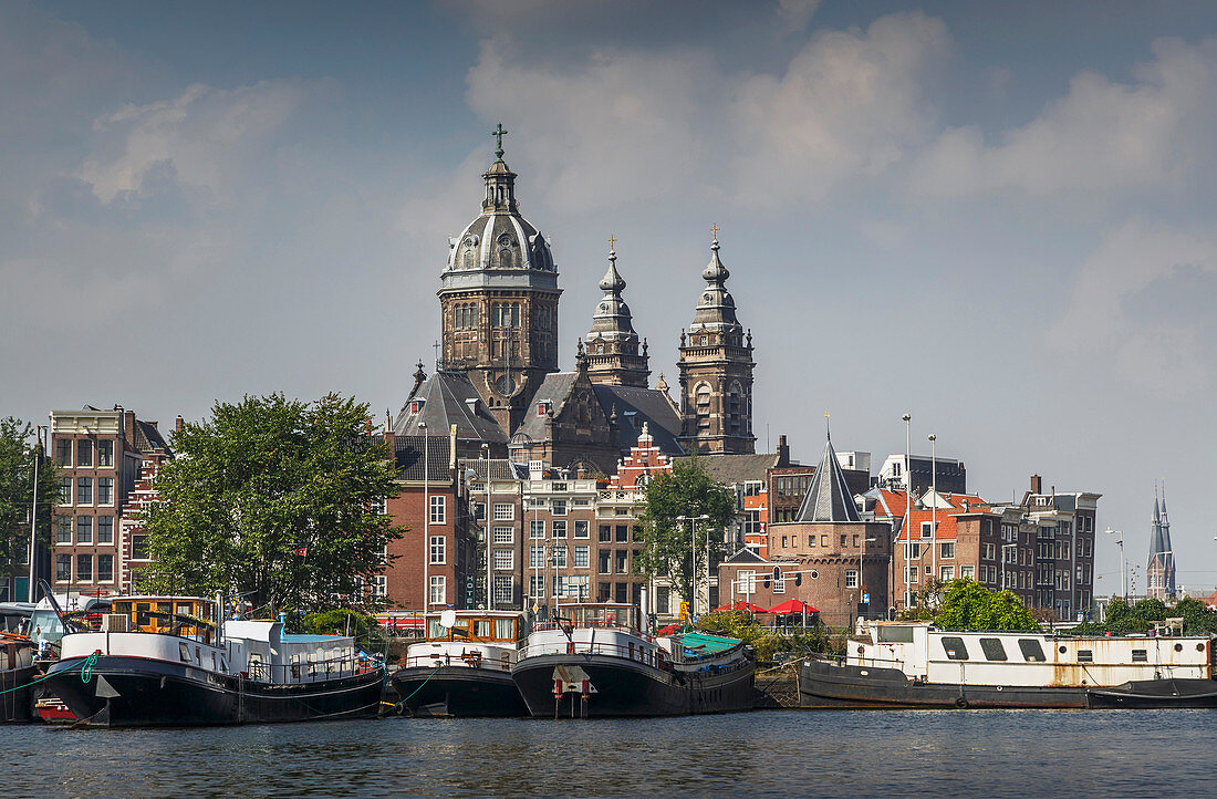 Ornate building over Amsterdam canal, Amsterdam, Holland