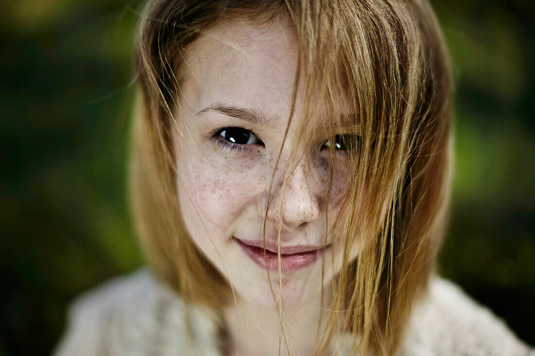 Smiling Caucasian girl with freckles