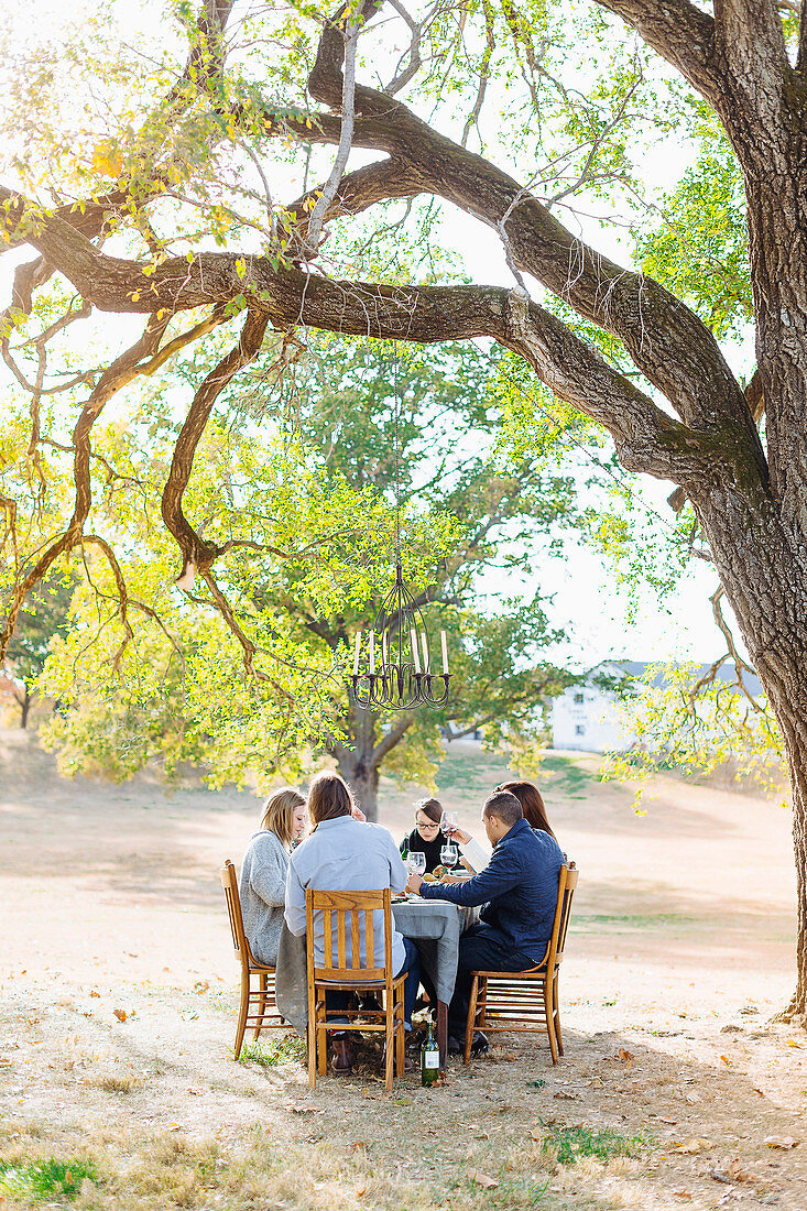 Friends eating at outdoor table