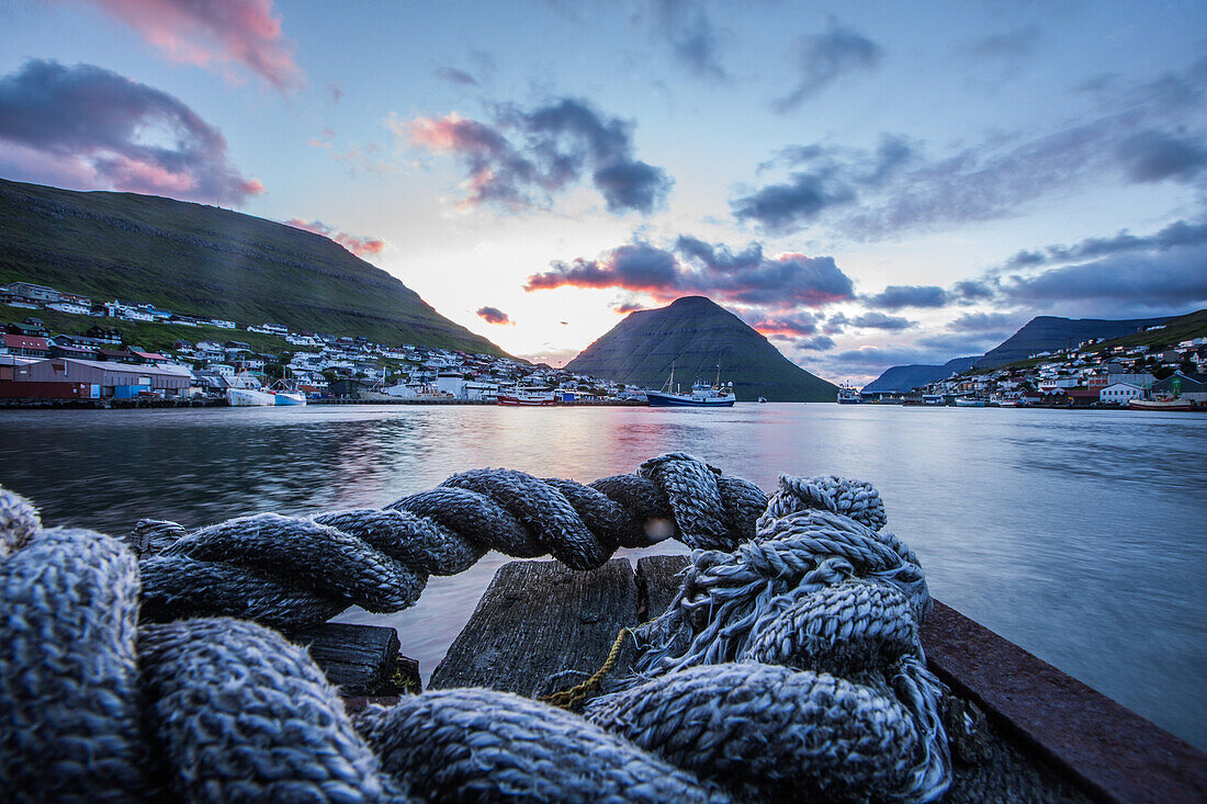 Little fishing village surrounded by green mountains, Faeroe Islands