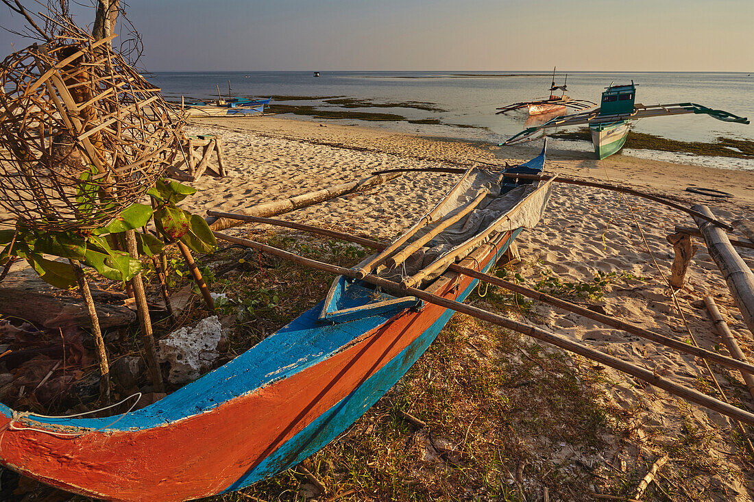 Fishing boats pulled up onto Paliton beach, Siquijor, Philippines, Southeast Asia, Asia