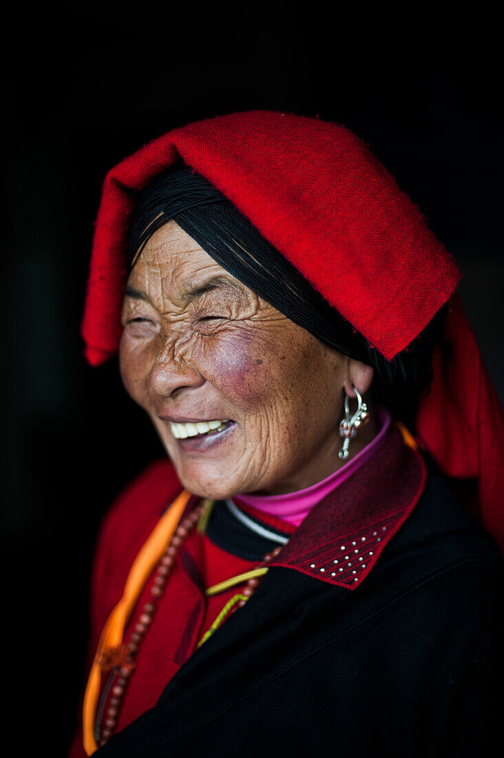 An Chinese Ngawa woman wearing traditionally bright dress in Songpa, Sichuan, China, Asia