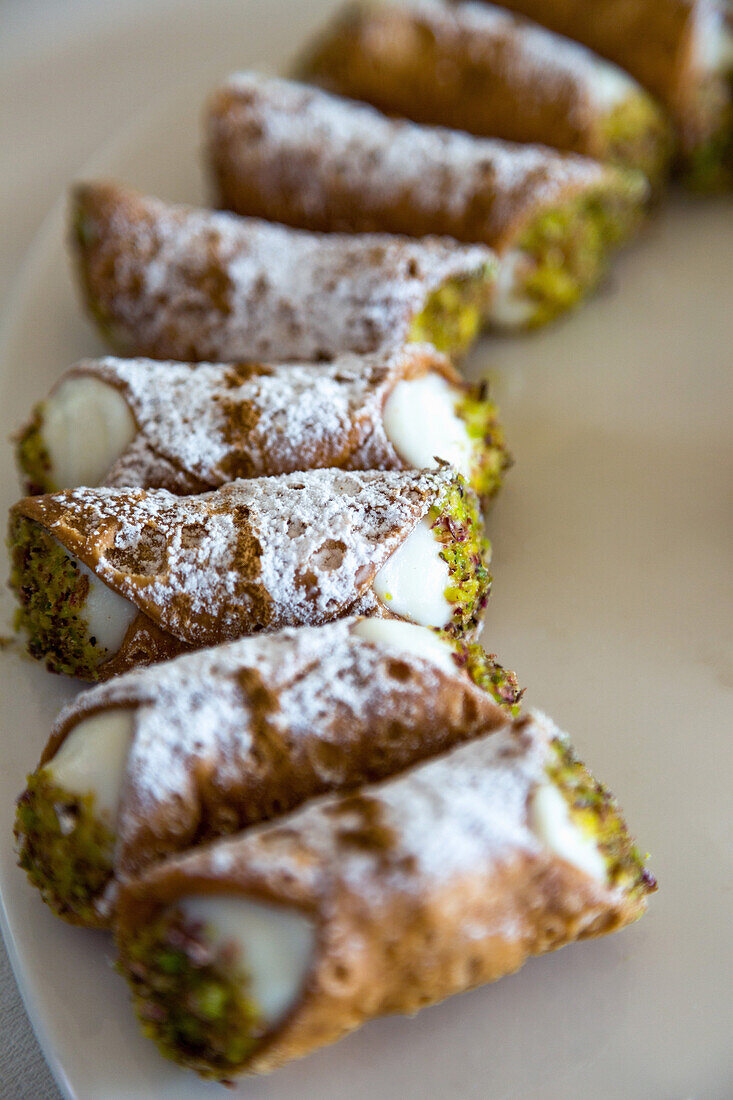 Traditional Sicilian Cannoli arranged on a plate, Sicily, Italy, Europe