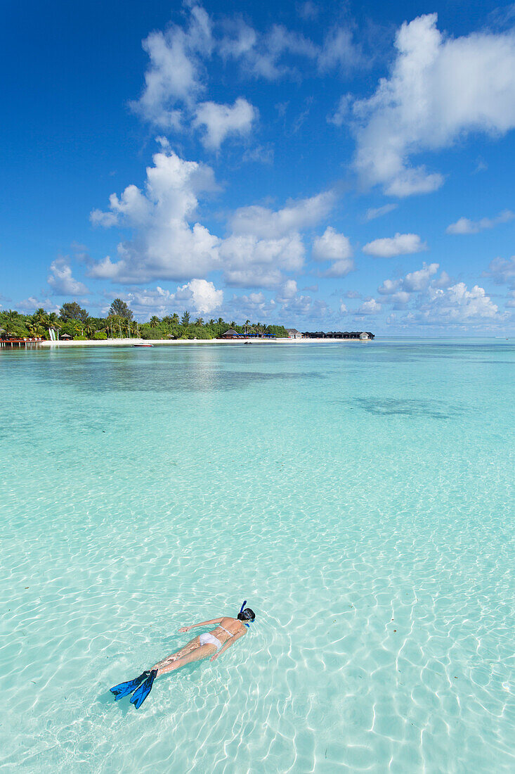 Woman snorkelling at Olhuveli Beach and Spa Resort, South Male Atoll, Kaafu Atoll, Maldives, Indian Ocean, Asia