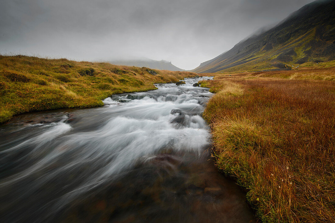 Snaefellsness, National Park, Glacial river flowing through mossy tundra, Iceland, Polar Regions