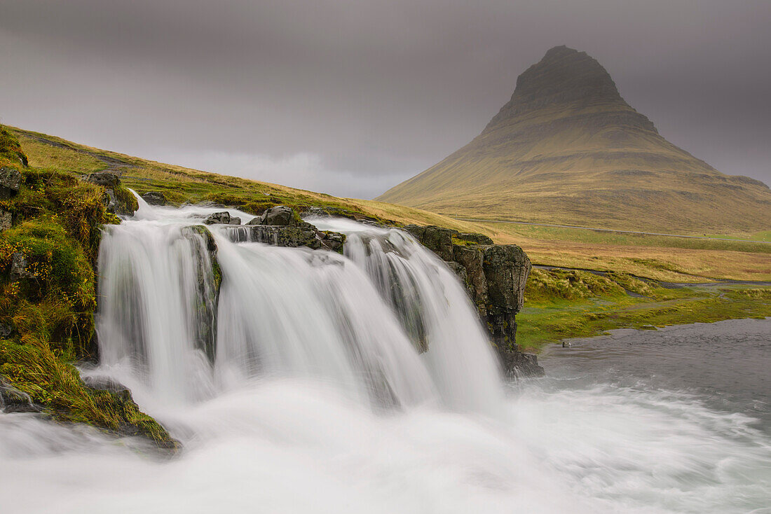 Kirkjufellsfoss on a cloudy day on the Snaefellsness Peninsula, Iceland, Polar Regions