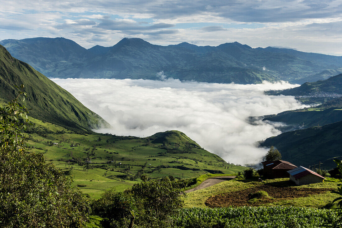Valley filled with cloud in Andes central highlands, hiding the Nariz del Diablo railway below Chunchi, Ecuador, South America