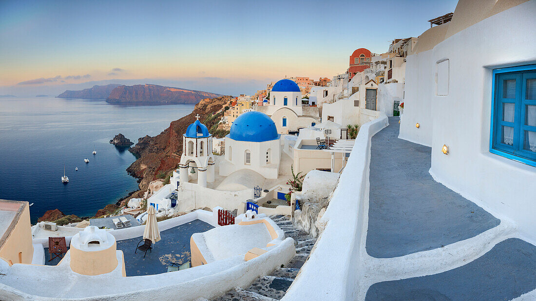 White houses and blue domes of the churches dominate the Aegean Sea, Oia, Santorini, Cyclades, Greek Islands, Greece, Europe