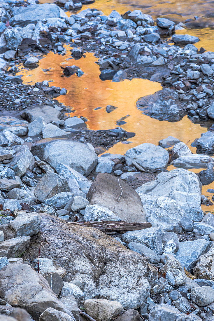 River landscape with stones in the evening, Spielmannsau, ice water, reflection, winter sun, Allgaeu, Oberallgaeu, Oberstdorf, Germany