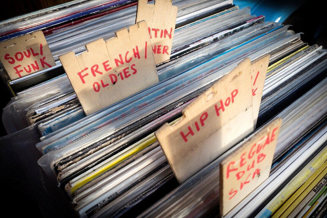 Vinyl records of different music styles: French oldies, hip hop, soul/funk, etc. Second-hand store. London, England