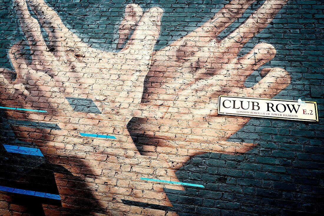 Street art, brick wall. Club Row, East End, London, England