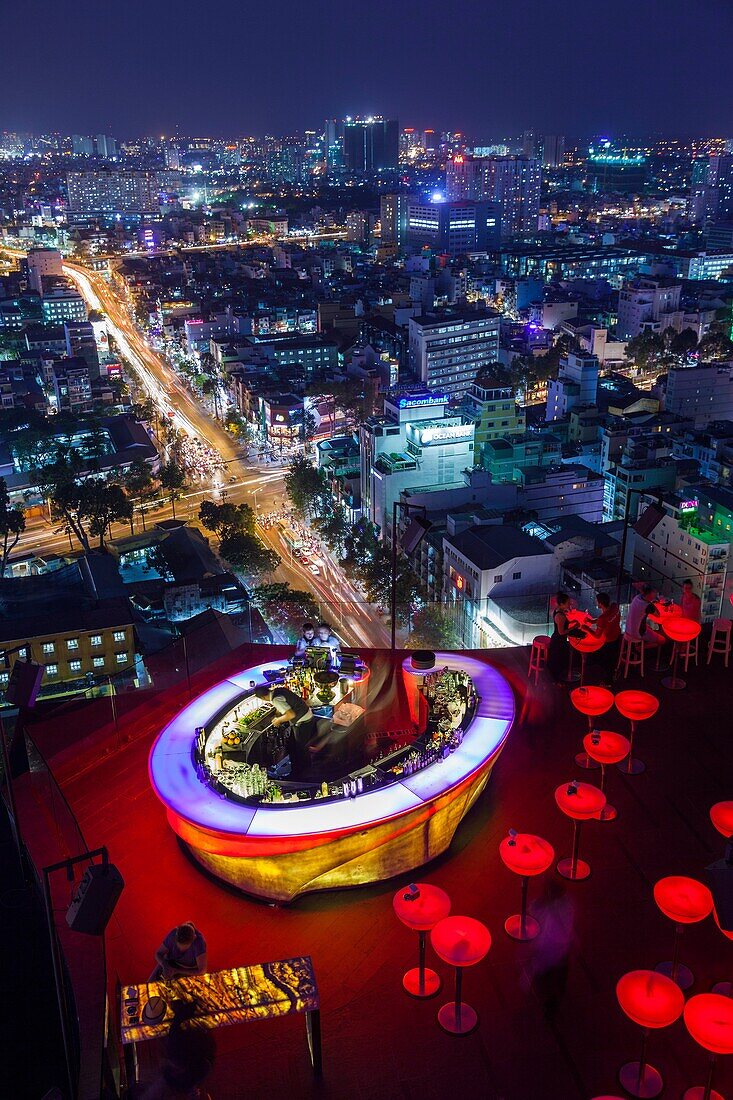 Vietnam, Ho Chi Minh City, elevated skyline view above the Chill Sky Bar, dusk.