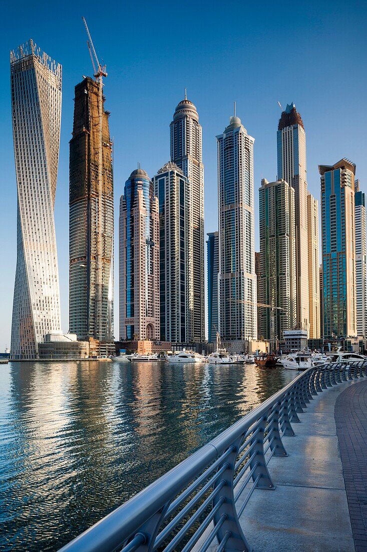 UAE, Dubai, Dubai Marina, high rise buildings including the twisted Cayan Tower, morning.