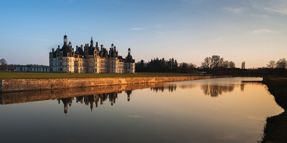 North west facade of Chateau de Chambord in the Loire Valley reflected in the River Cosson, UNESCO World Heritage Site, Loir et Cher, Pays de la Loire, Centre, France, Europe