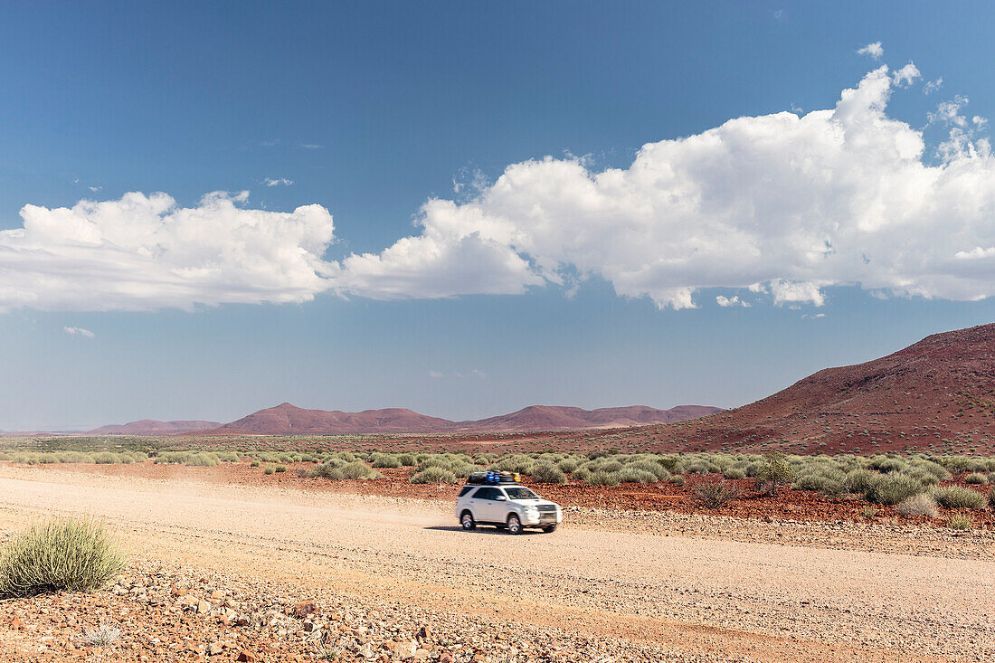 All-terrain vehicle on a dirt road in Damaraland, Kunene, Namibia