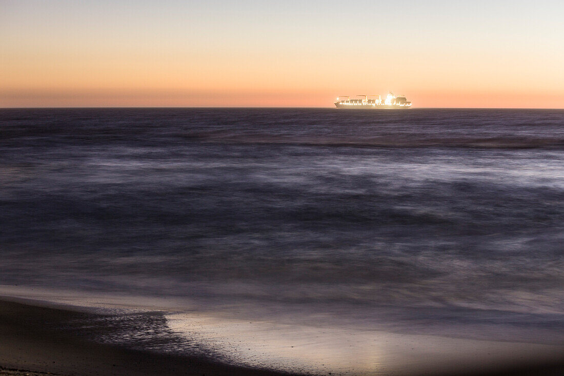 A container vessel approaching Swakopmund in the Atlantic coast, Erongo, Namibia, Africa.