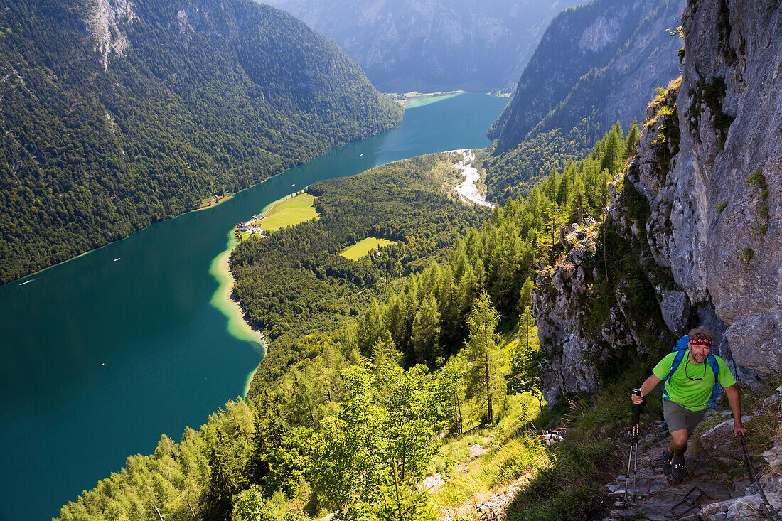 Hiker at Rinnkendlsteig from St. Bartholomä to Achenkanzel, Königssee, Berchtesgaden National Park, Berchtesgadener Land, Bavaria, Germany, Europe