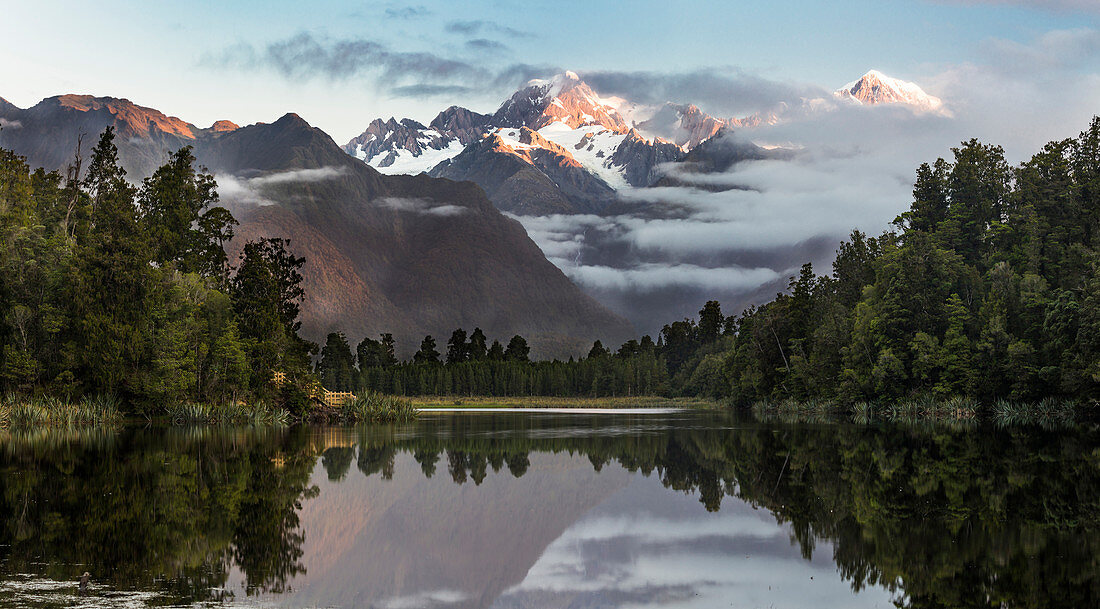 Reflection in the water, Lake Matheson, Mount Cook, Mount Tasman, Westland Tai Poutini National Park, West Coast, South Island, New Zealand, Oceania