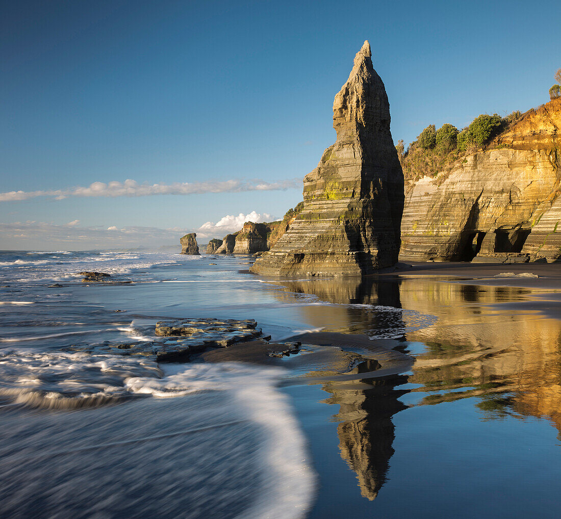 Rock formation and refection in the water, Tongaporutu, Taranaki, North Island, New Zealand, Oceania