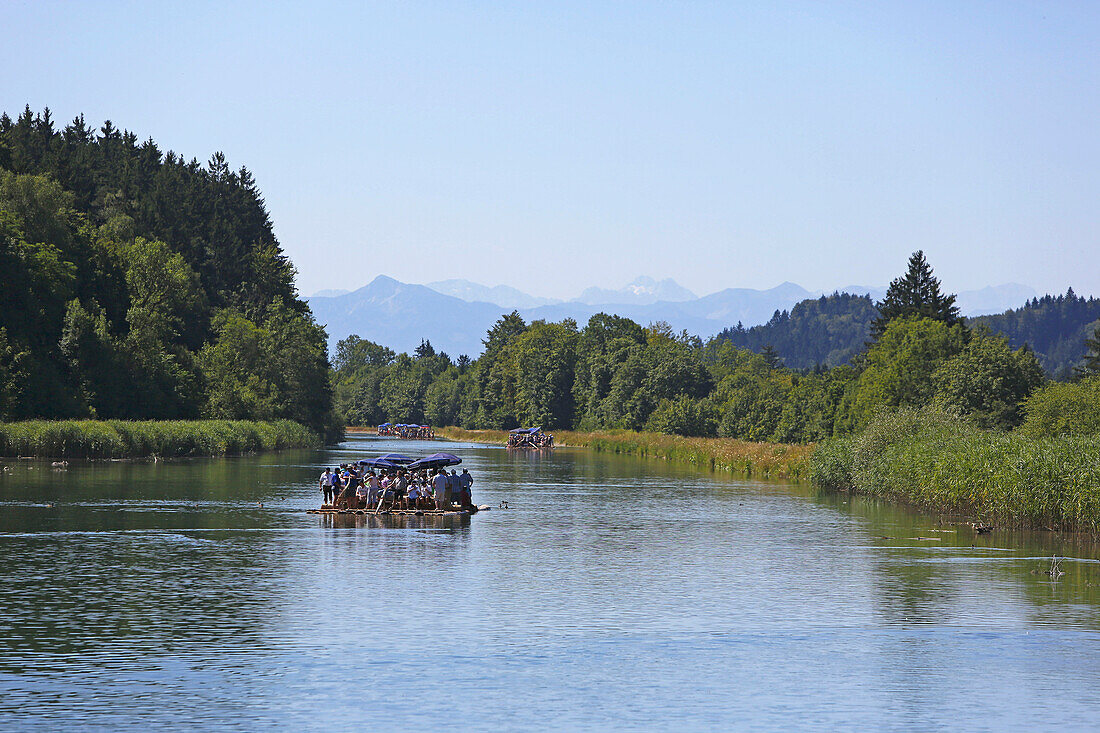 People on a traditional wood raft, river Isar, Munich, Upper Bavaria, Bavaria, Germany