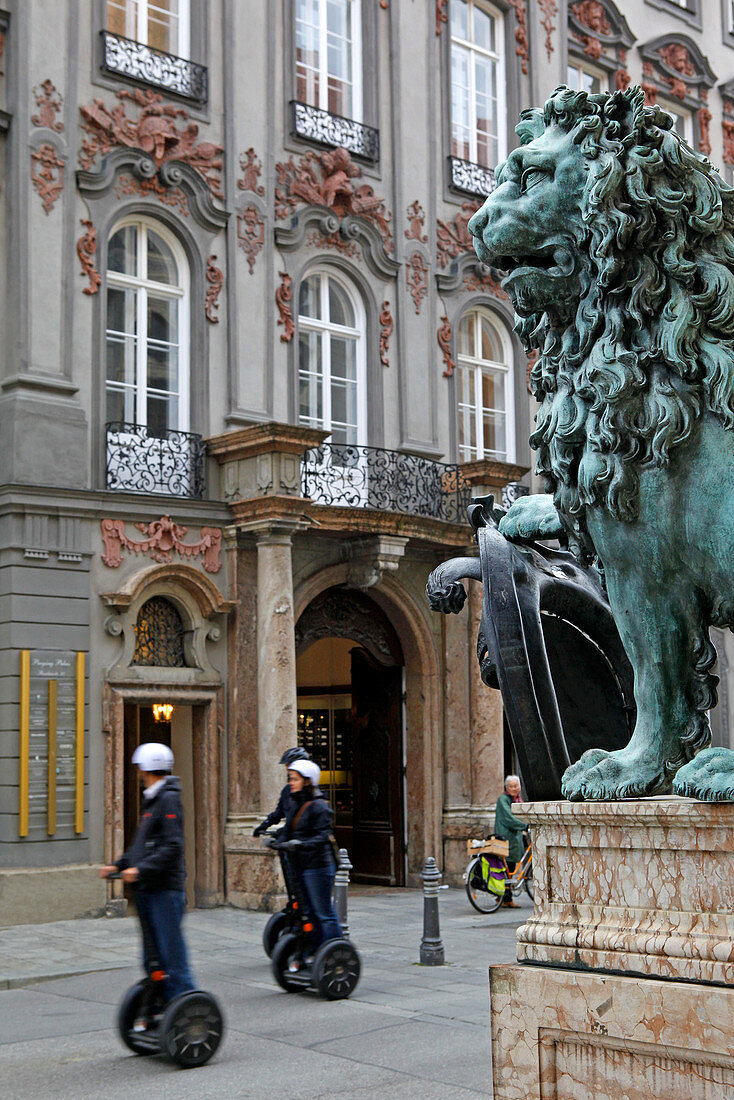 Segway city tour, Lion flanking the entrance of Residenz and Palais Preysing, Residenzstrasse, Munich, Upper Bavaria, Bavaria, Germany